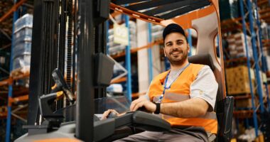 Man On A Forklift In One Of Carousel's Warehouse Facilities Handling Returned Goods