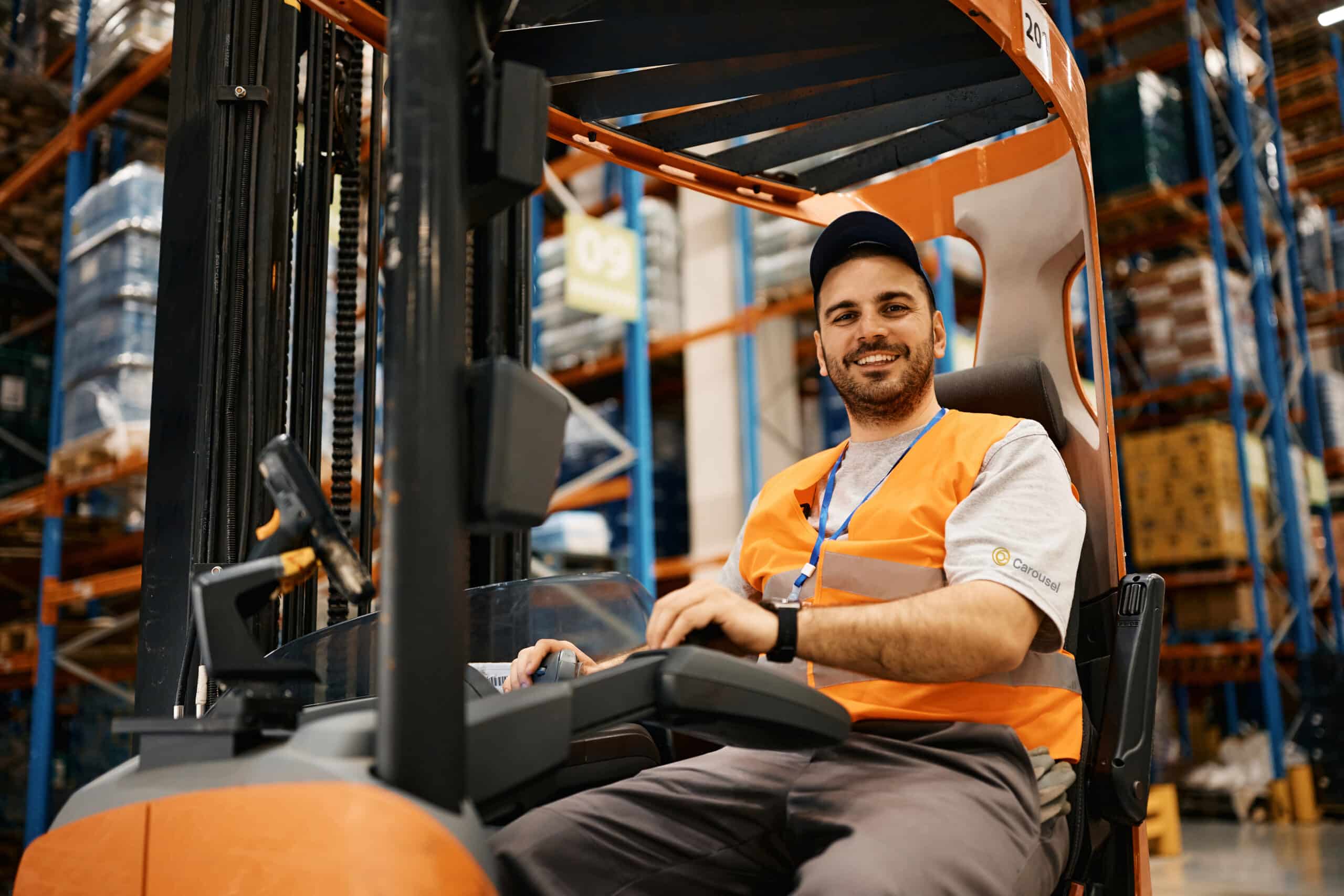 Man on a forklift in one of Carousel's warehouse facilities handling returned goods